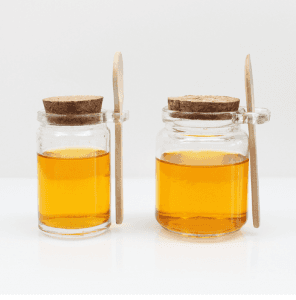 Storage jar with wooden spoon, glass jar with spoon
