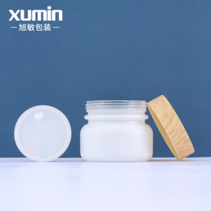 China OEM Amber Bottles - matte white glass jar 50g cosmetic cream jar with bamboo lid – Xumin