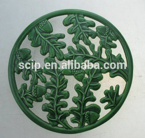 round shape cast iron trivet green color