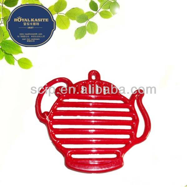 red cast iron teapot trivet