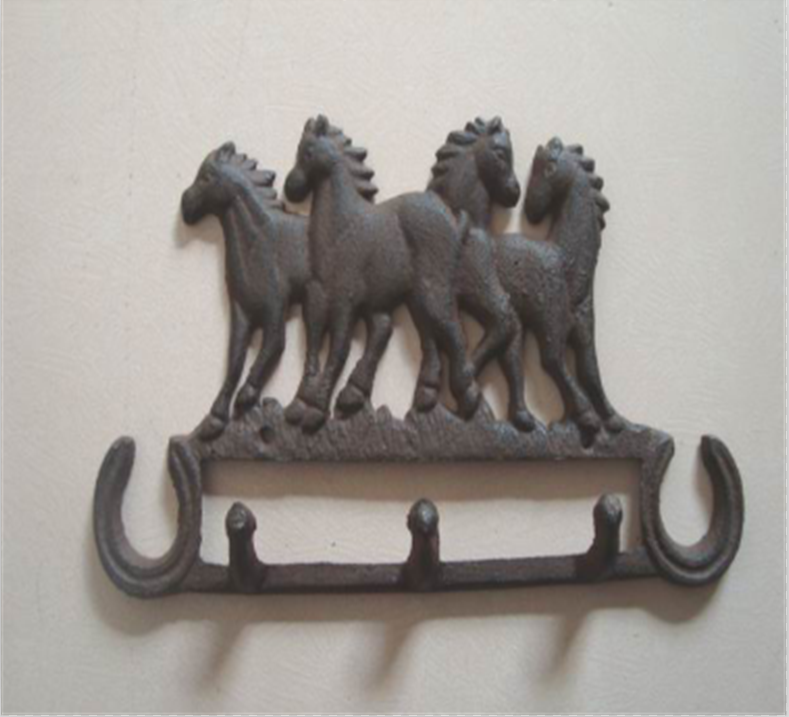 cast iron coat hook with four horse heads