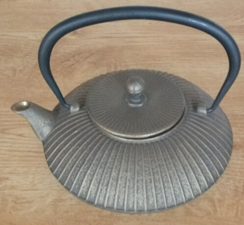 golden cast iron teapot