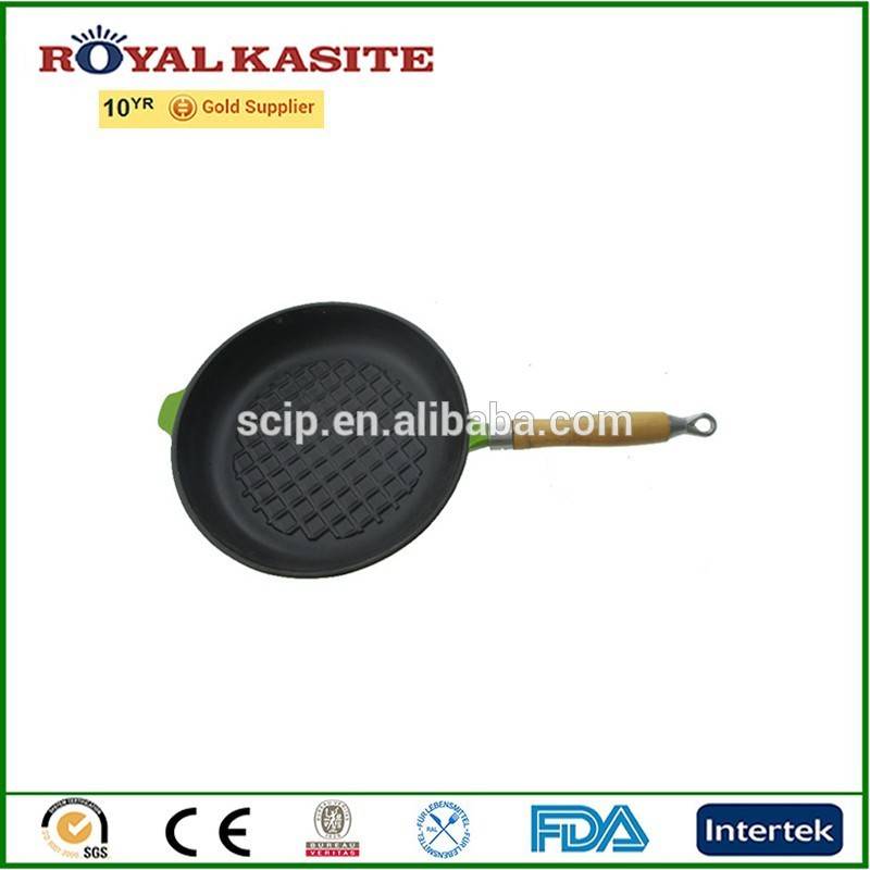 green frying pan with wooden handle, cast iron plate with ribs, enamel iron skillet