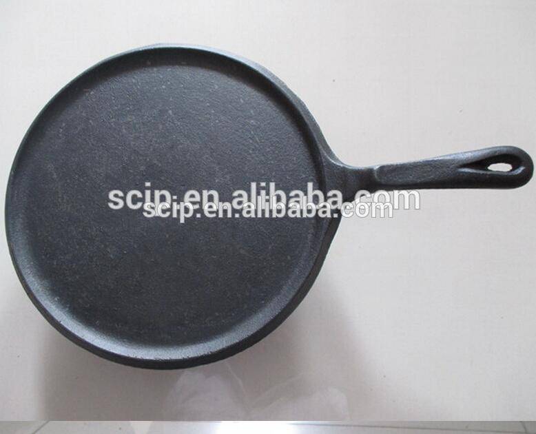 round cast iron fry pan with vegetable oil coating