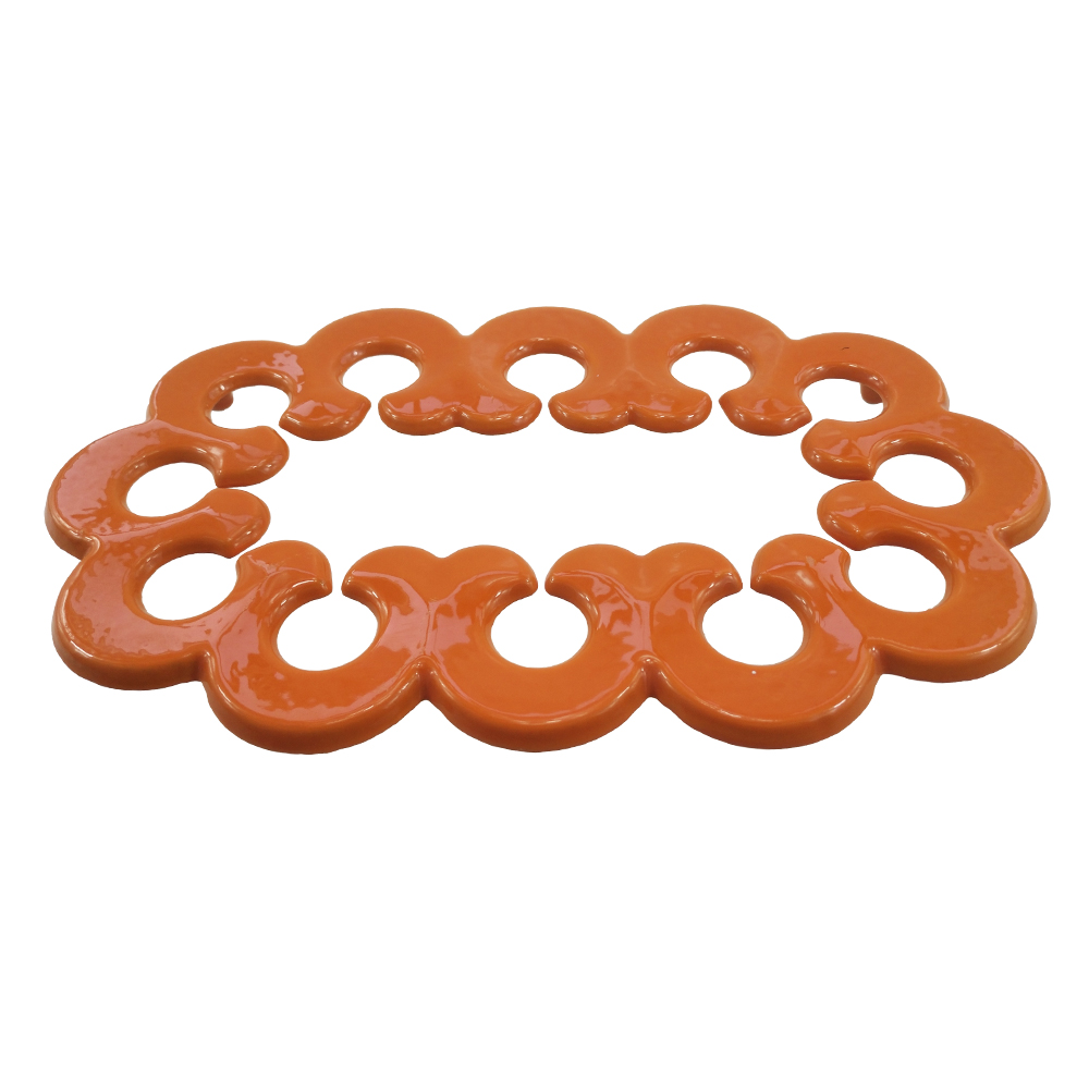 orange oval cast iron table mat in enamel coating