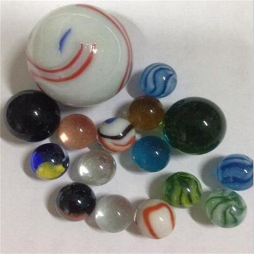 Transparent twisted natural color glass marble Featured Image