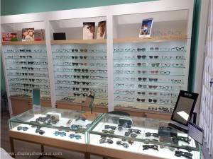 Custom Wooden veneer and S.Steel Eyeglass shop interior displays design