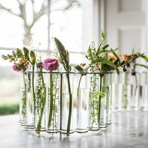 glass test tube vase in metal or wood rack for home decoration