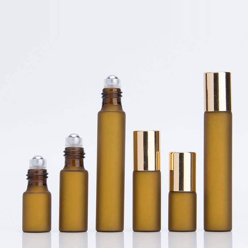 custom made 3ml 5ml 10ml amber roll on glass vials with shiny gold cap or black plastic cap Featured Image