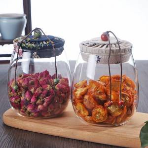 clear high borosilicate glass tea storage jar with flower cloth cork lid