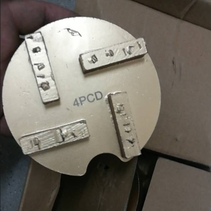PCD pads for epoxy coating removal