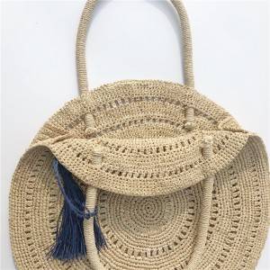 Big round handmade raffia straw bag with tassel