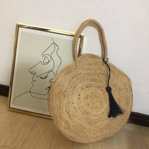 Big round handmade raffia straw bag with tassel