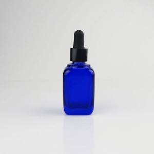 Coalt नीले वर्ग आवश्यक तेल की बोतल कस्टम डिजाइन कॉस्मेटिक कांच ड्रॉपर बोतल निर्माता