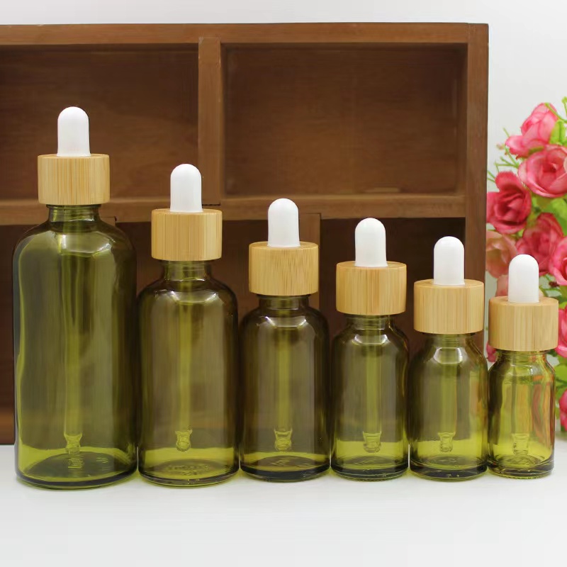 Wholesale olive-green 10ml /15ml 20ml/30ml /50ml serum glass bottle with bamboo dropper Featured Image