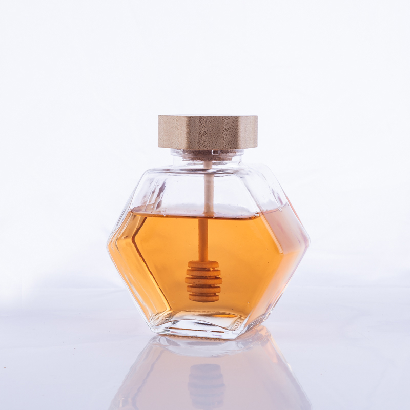 Hexagonal glass honey jar with wooden cap Featured Image